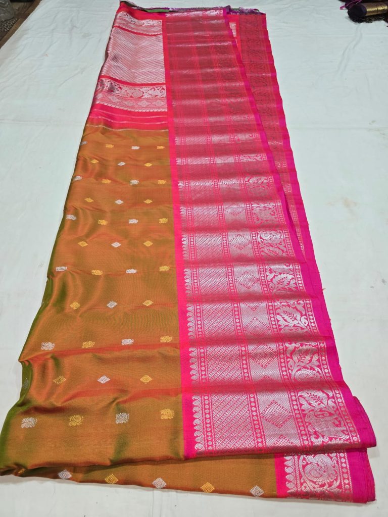 Rust with pink border in small Butta Pure Gadwa silk saree